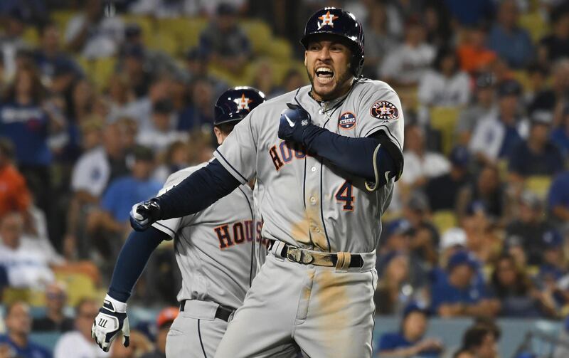 Oct 25, 2017; Los Angeles, CA, USA; Houston Astros center fielder George Springer (4) celebrates his two run home run in the eleventh inning against the Los Angeles Dodgers in game two of the 2017 World Series at Dodger Stadium. Mandatory Credit: Richard Mackson-USA TODAY Sports