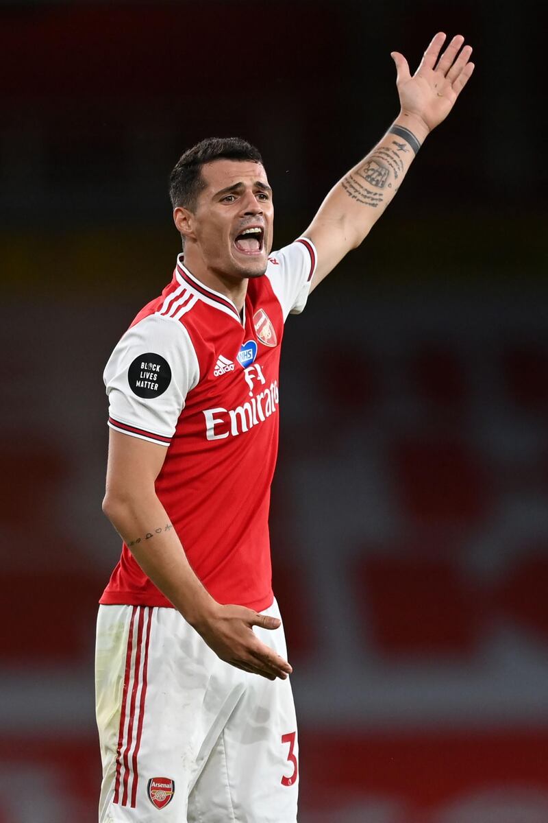 Granit Xhaka - 7: Made some vital interceptions in the second half and threw himself in front of every ball. AFP