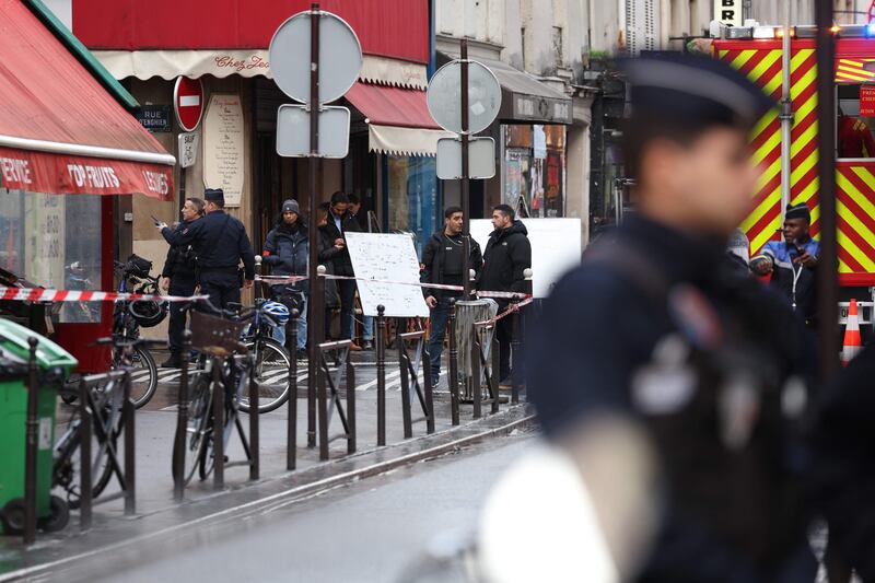 Police secure the street after the gunman opened fire. AFP