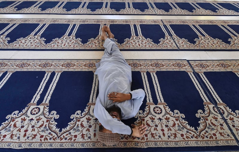 A Pakistani worshipper rests at a mosque in Karachi. EPA 