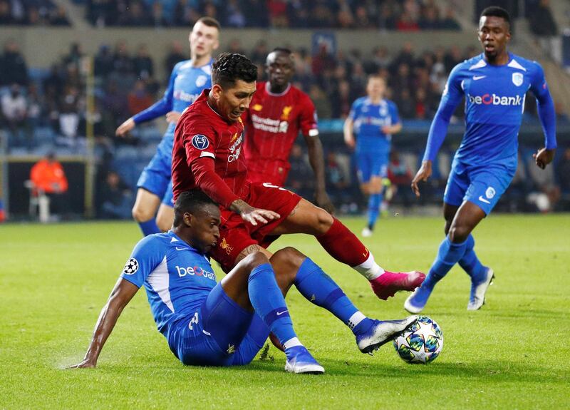 Genk's Jhon Lucumi tackles Liverpool's Roberto Firmino. Reuters