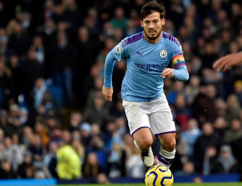 FILE - In this Saturday, Dec. 7, 2019 file photo, Manchester City's David Silva during their English Premier League soccer match against Manchester United at Etihad stadium in Manchester, England. Hundreds of players across Europe's soccer leagues have contracts which are due to expire at the end of this season. That poses a big problem if those leagues over-run beyond the June 30 cut-off point as expected because of the outbreak of the coronavirus. Silva is among dozens of Premier League players, and hundreds of players across Europe, whose contracts are due to expire at the end of this season. June 30, to be specific. (AP Photo/Rui Vieira, file)