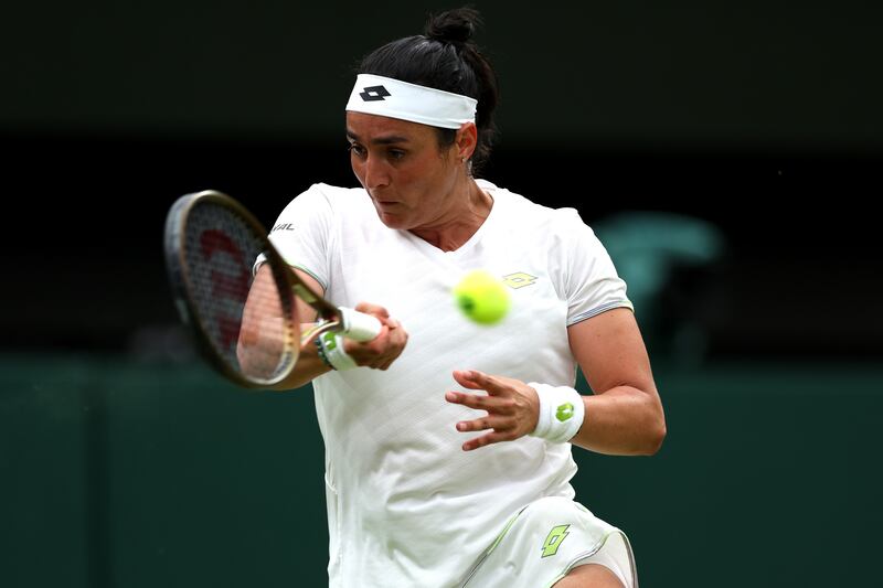 Ons Jabeur plays a forehand against Aryna Sabalenka in their Wimbledon semi-final at the All England Club. Getty