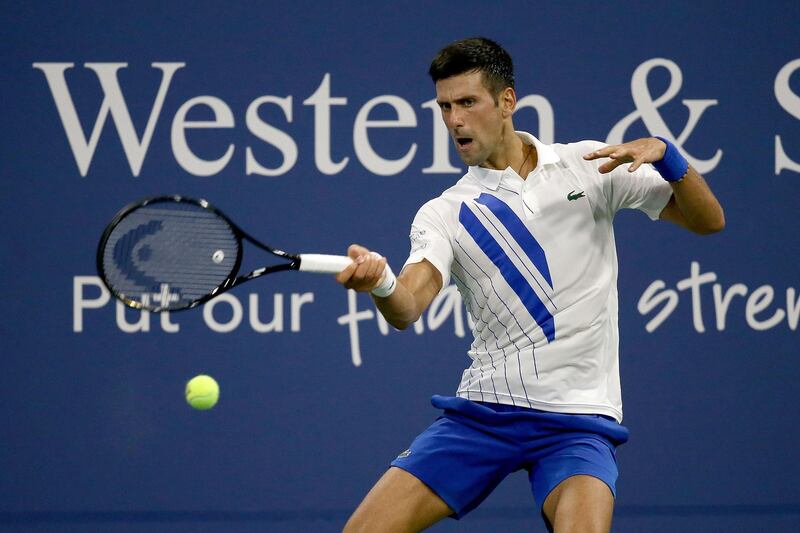 NEW YORK, NEW YORK - AUGUST 23: Novak Djokovic of Serbia returns a shot to Ricardas Berankis of Lithuania during the Western & Southern Open at the USTA Billie Jean King National Tennis Center on August 24, 2020 in the Queens borough of New York City.   Matthew Stockman/Getty Images/AFP
== FOR NEWSPAPERS, INTERNET, TELCOS & TELEVISION USE ONLY ==
