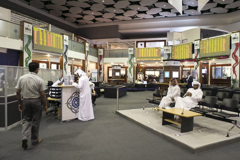 Traders on the floor of the Dubai Financial Market. Reem Mohammed / The National