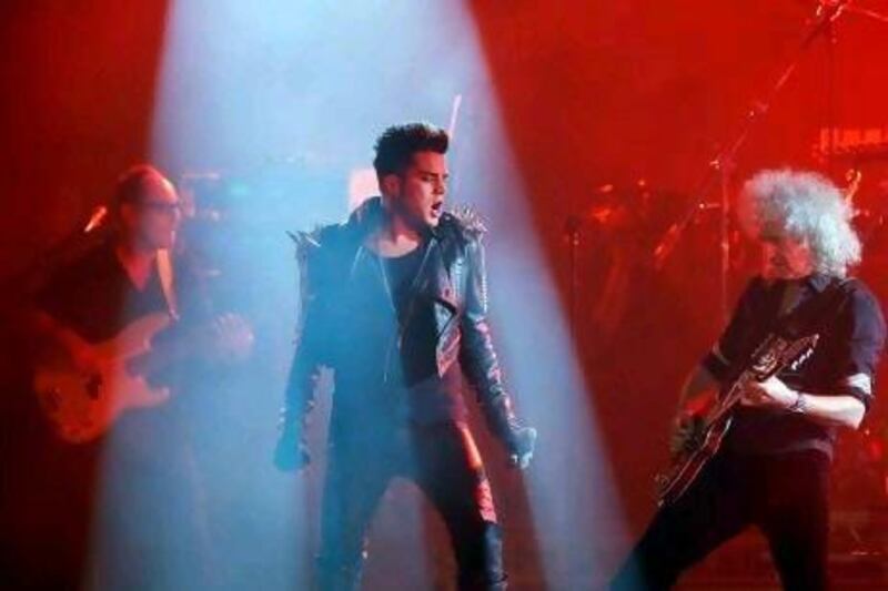 Adam Lambert, centre, performs with British guitarist Brian May, right, and the band Queen during pre-final festivities that also included a concert by Sir Elton John.