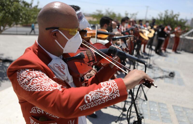 Mariachi musicians offer a serenade to workers of the Regional General Hospital number 66, of the Mexican Institute of Social Security in Ciudad Juarez, Chihuahua State, Mexico. AFP