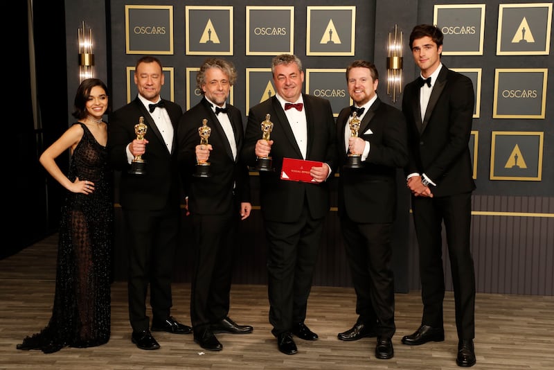 Brian Connor, second from left, Paul Lambert, third from left, Gerd Nefzer, third from right, and Tristan Myles, second from right, winners of the Oscar for Best Visual Effects for 'Dune', pose with presenters Rachel Zegler, left, and Jacob Elordi, right, in the press room. EPA