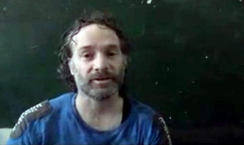 In this image made from undated video obtained by The Associated Press, Peter Theo Curtis, a US citizen held hostage by an Al Qaeda-linked group in Syria, delivers a statement. The US government said on Sunday, August 24, 2014 that Mr Curtis, who had been held hostage for about two years, had been released. AP Photo