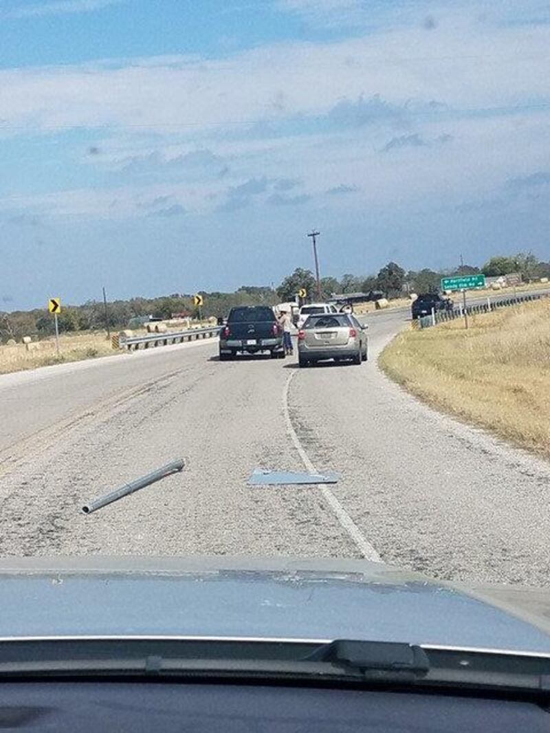 A damaged road sign is seen after a police chase near Sutherland Springs, Texas, U.S., November 5, 2017, in this picture obtained from social media. Liz Summers/via REUTERS THIS IMAGE HAS BEEN SUPPLIED BY A THIRD PARTY. MANDATORY CREDIT.NO RESALES. NO ARCHIVES