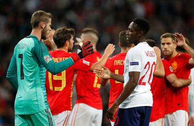 Spain goalkeeper David de Gea, left, shakes hands with England's Danny Welbeck at the end of the UEFA Nations League soccer match between England and Spain at Wembley stadium in London, Saturday Sept. 8, 2018. Spain won 2-1. (AP Photo/Frank Augstein)