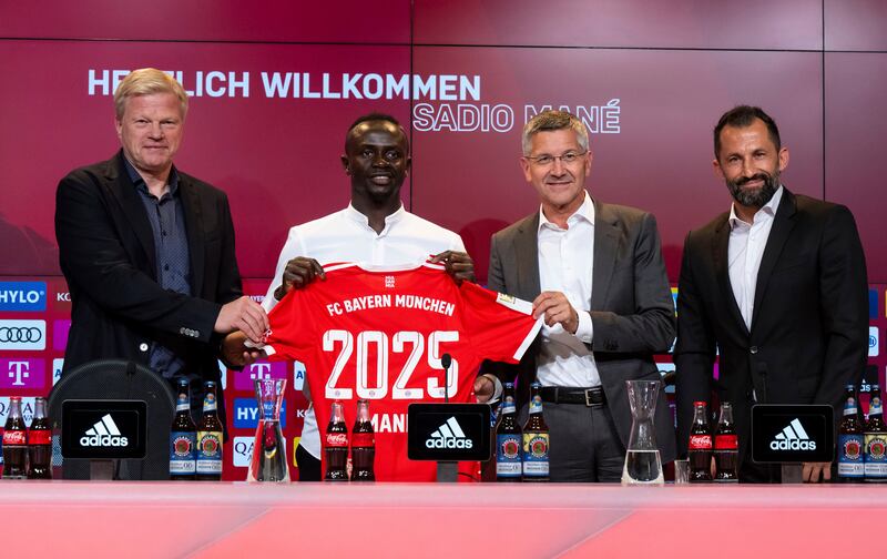 From left, Bayern's chief executive Oliver Kahn, Sadio Mane, club president Herbert Hainer and sports director Hasan Salihamidzic. AP