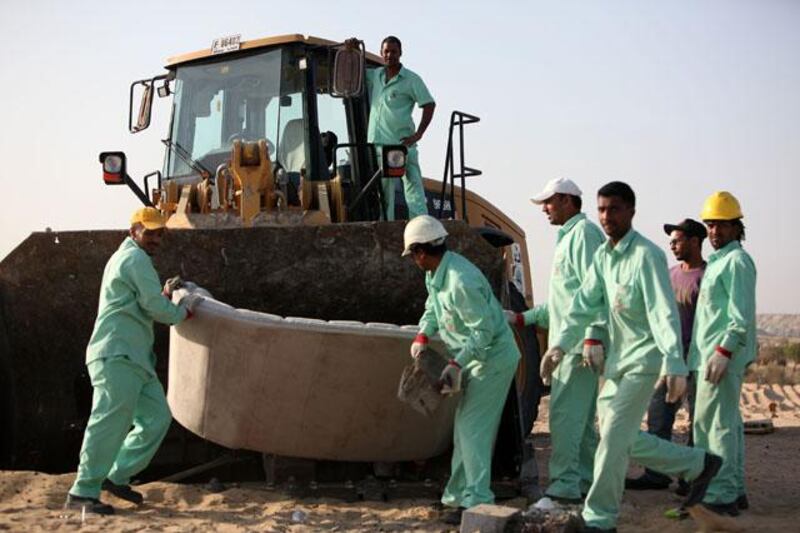 
DUBAI , UNITED ARAB EMIRATES  Ð  Nov 28 : Workers from Dubai Municipality demolishing the winter camps which are without permit in Al Mushrif area in Dubai. ( Pawan Singh / The National ) For News. Story by Mohammed Al Khan