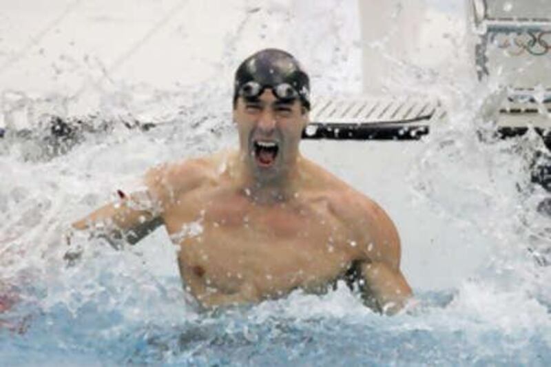 Michael Phelps of the US celebrates after winning the 100m butterfly gold medal at the Beijing Olympic Games.