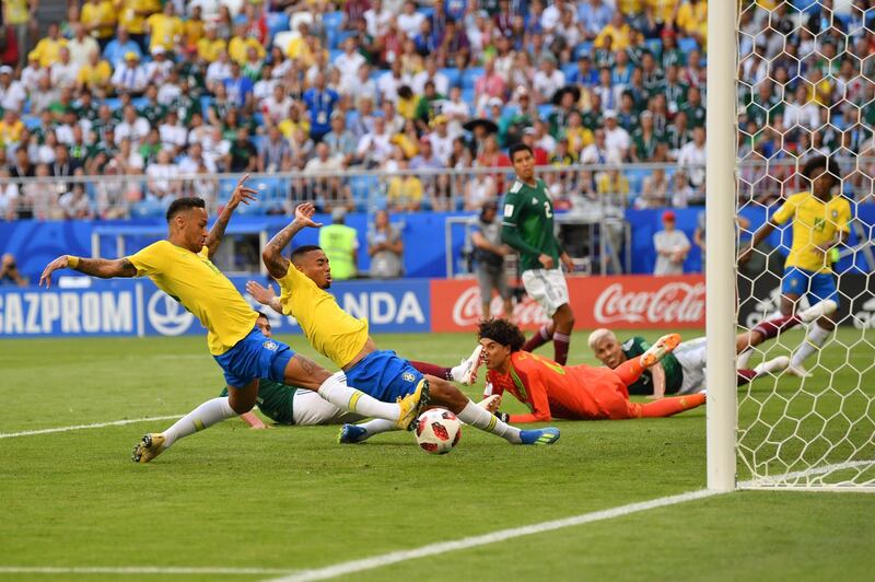 Neymar scores Brazil's first goal against Mexico. Dan Mullan / Getty Images