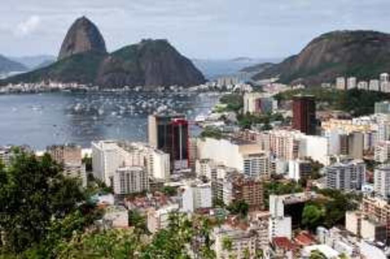 Buildings stand near Sugarloaf Mountain along Guanabara Bay in Rio de Janeiro, Brazil, on Friday, Sept. 25, 2009. The International Olympic Committee (IOC) will choose on Oct. 2 between Rio de Janeiro, Chicago, Madrid, and Tokyo to host the 2016 Summer Olympics. Brazil is the only country is among the world's 10 richest to never host the Olympic games. Photographer: Douglas Engle/Bloomberg
 *** Local Caption ***  574415.jpg