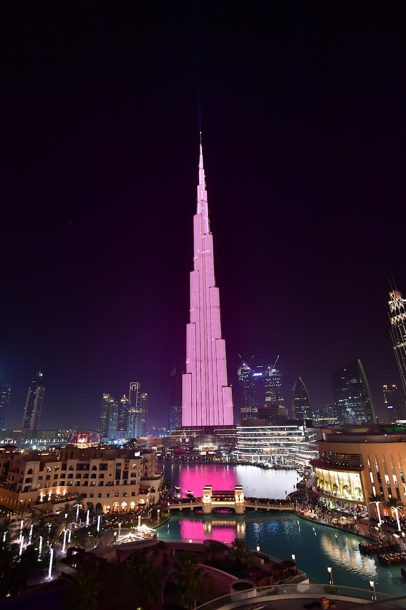 A picture taken on March 29, 2018 shows a laser show on the Burj Khalifa, the tallest tower in the world, in downtown Dubai. (Photo by GIUSEPPE CACACE / AFP)