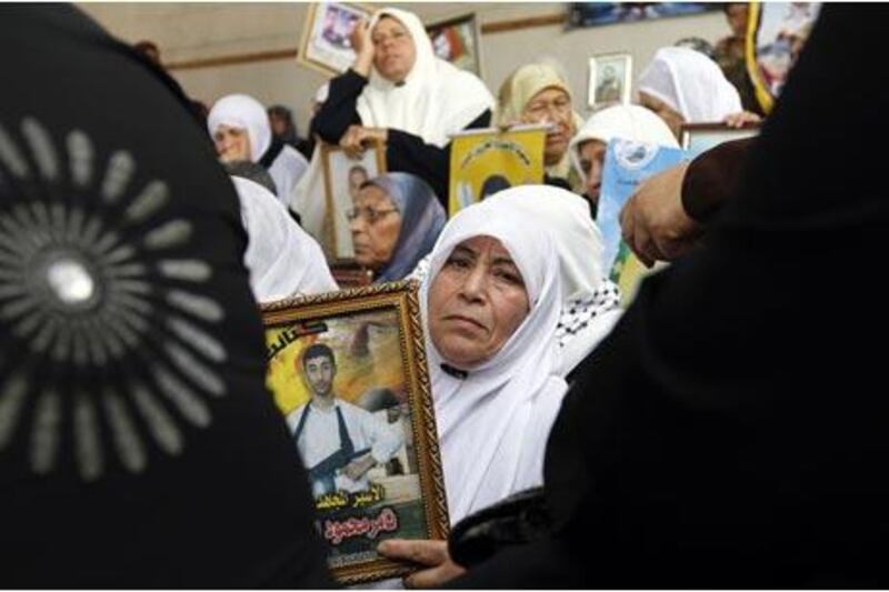 Palestinian women attend a rally at the Red Cross offices in Gaza City to call for the release of Palestinian prisoners held in Israeli jails.