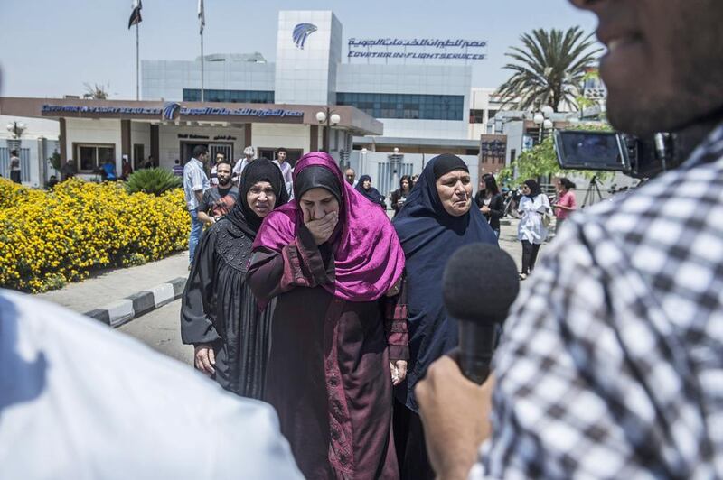 Distraught family members of passengers aboard the EgyptAir plane that disappeared en route from Paris to Cairo make their way to a gathering point at Cairo airport. Khaled Desouki / AFP