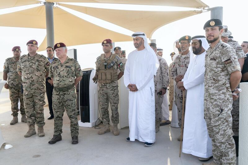 AL DHAFRA REGION, ABU DHABI, UNITED ARAB EMIRATES - June 26, 2019: HRH Hussein bin Abdullah, Crown Prince of Jordan (R), HH Sheikh Tahnoon bin Mohamed Al Nahyan, Ruler's Representative in Al Ain Region (2nd R), HE Lt General Hamad Thani Al Romaithi, Chief of Staff UAE Armed Forces (3rd R), HH Sheikh Mohamed bin Zayed Al Nahyan, Crown Prince of Abu Dhabi and Deputy Supreme Commander of the UAE Armed Forces (4th R) and HM King Abdullah II, King of Jordan (6th R), attend the UAE and Jordan joint military drill, Titled ‘Bonds of Strength’, at Al Hamra Camp.

( Rashed Al Mansoori / Ministry of Presidential Affairs )
---