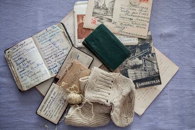 Valuables that Olga Sergeevna Gracheva, a prominent Soviet geologist, kept in her purse: notebooks, a membership card for the mineral society, mineral fragments, a letter from her son, and unfinished baby booties. Olga is the protagonist of a mixed-media book by her granddaughter, Russian artist Xenia Nikolskaya. Photo: Xenia Nikolskaya