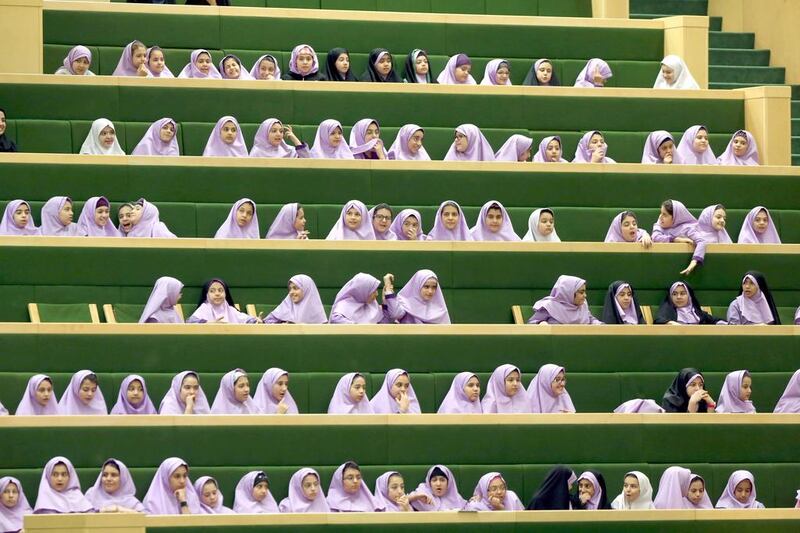 Iranian school girls attend a parliament session in Tehran on March 1, 2016. Atta Kenare / Agence France-Presse