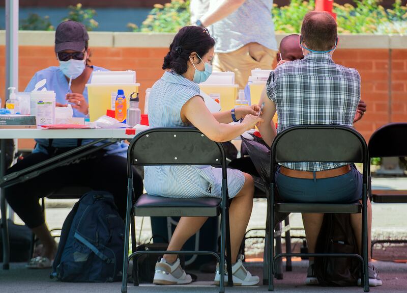 A man receives a monkeypox vaccine at an outdoor walk-in clinic in Montreal on Saturday, July 23. AP