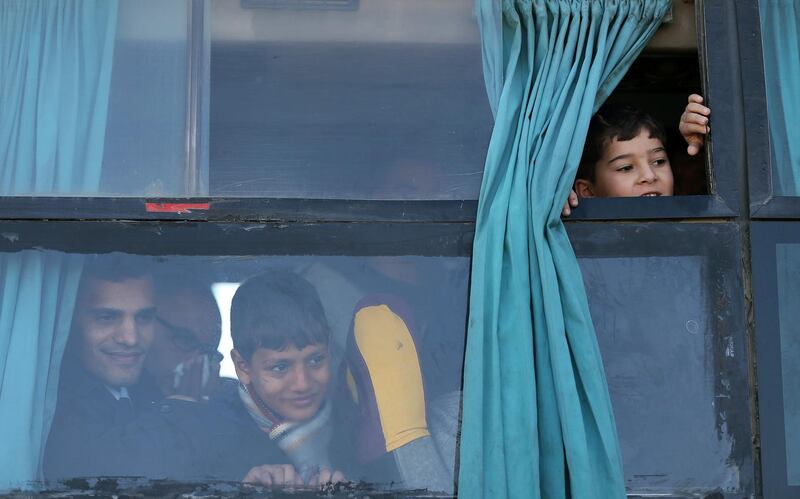 Palestinians look out of a bus as they wait to leave Gaza through Rafah border crossing with Egypt, in Rafah, in the southern Gaza Strip. Reuters