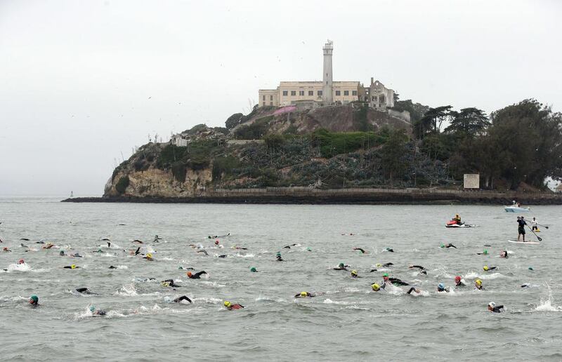 Competitors swim past Alcatraz at the start of the 34th Escape from Alcatraz Triathlon on Sunday in San Francisco, California. Ezra Shaw / Getty Images / AFP / June 1, 2014