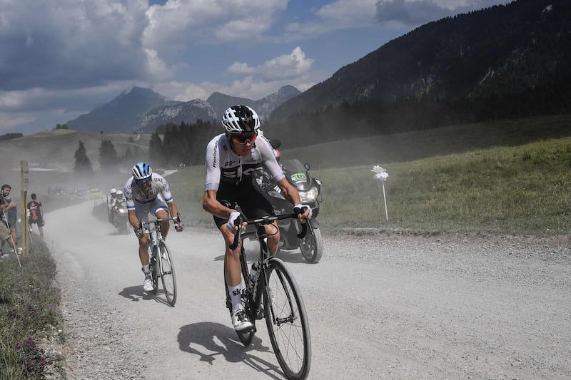 Great Britain's Christopher Froome, centre, rides in the ascent of the Plateau des Glieres during the 10th stage of the Tour de France between Annecy and Le Grand-Bornand. Jeff Pachoud / AFP