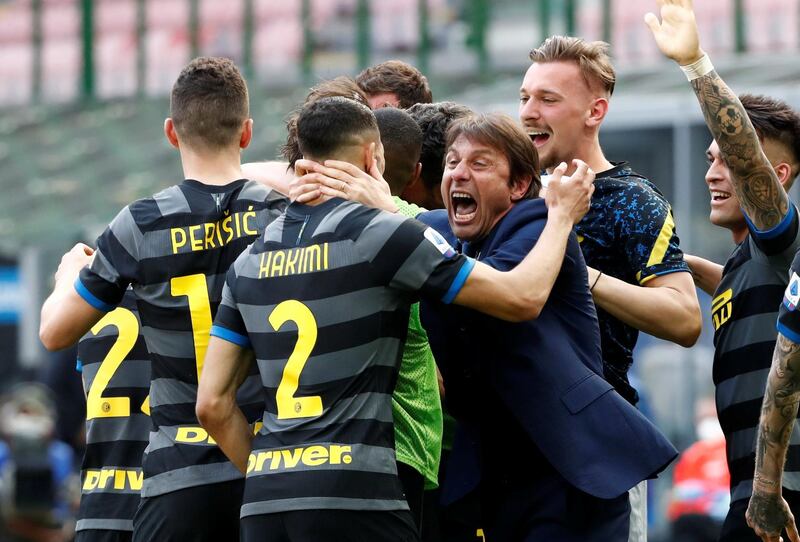 Inter coach Antonio Conte joins in the celebrations. Reuters
