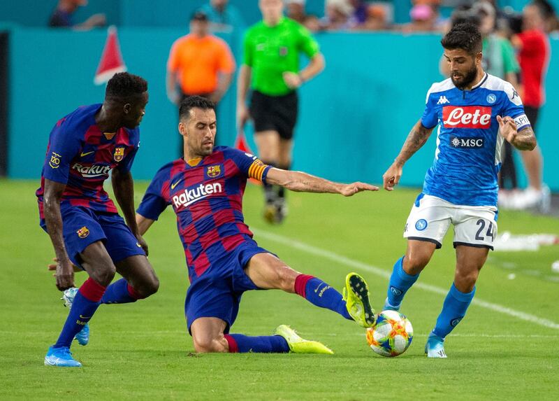 Sergio Busquets, who scored Barcelona's opener, slides in for a ball. EPA