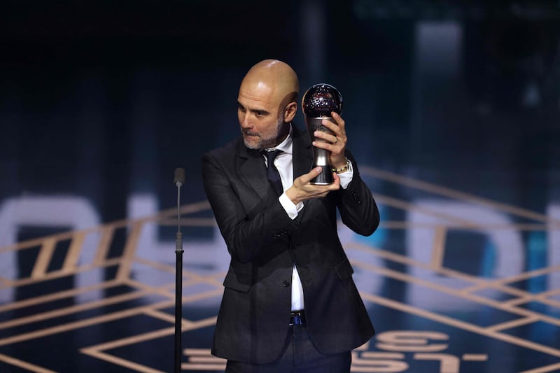 Manchester City coach Pep Guardiola receives The Best Fifa Men's Coach award. AFP