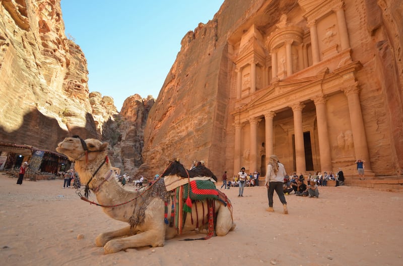 Tourists gather in front of the treasury site in the ancient city of Petra, Jordan.