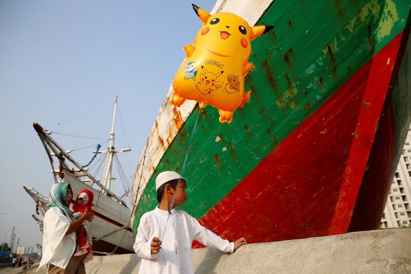 A boy waits for a ferry at Sunda Kelapa port in Jakarta, Indonesia. Darren Whiteside / Reuters