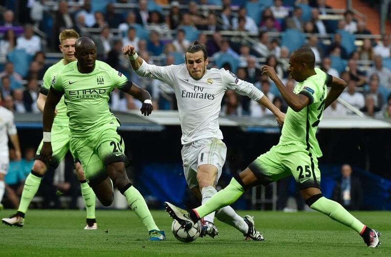 Real Madrid’s Welsh forward Gareth Bale, centre, vies with Manchester City’s French defender Eliaquim Mangala, left, and Manchester City’s Brazilian midfielder Fernandinho. Gerard Julien / AFP