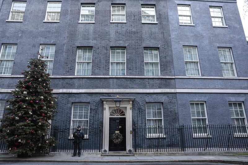 A police officer on patrol at number 10 Downing Street in London, U.K., on Thursday, Dec. 24, 2020. The U.K. and the European Union are on the verge of unveiling a historic post-Brexit trade accord as negotiators work through the night to put the finishing touches to a compromise on fishing rights. Photographer: Jason Alden/Bloomberg