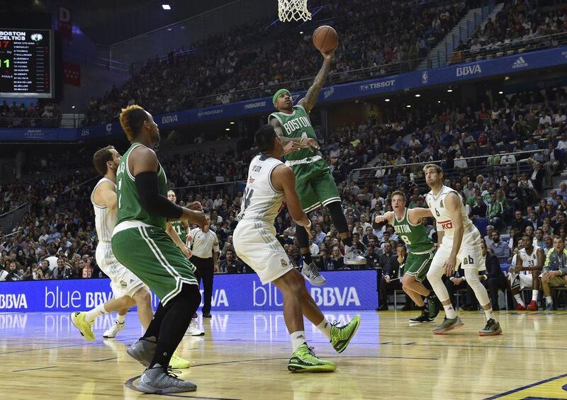 Isaiah Thomas of the Boston Celtics goes up for a layup during his team’s pre-season game against Real Madrid on Thursday night in Spain. Gerard Julien / AFP