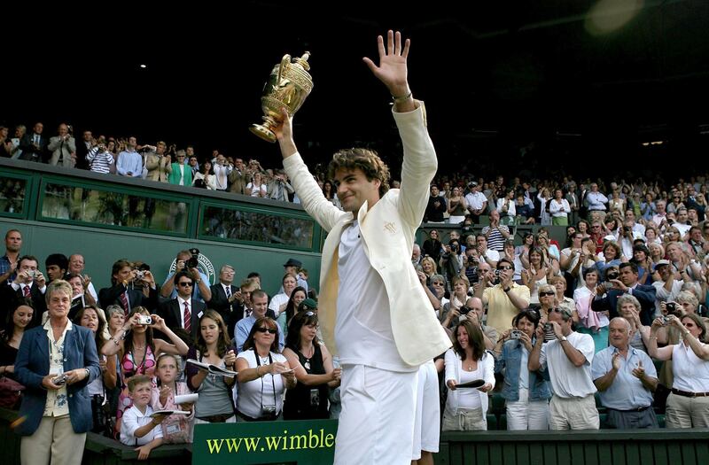 LONDON - JULY 09:  Roger Federer of Switzerland holds aloft the trophy as the crowd applaude after he won the Men's final against Rafael Nadal of Spain on day thirteen of the Wimbledon Lawn Tennis Championships at the All England Lawn Tennis and Croquet Club on July 9, 2006 in London, England.  (Photo by Clive Brunskill/Getty Images)