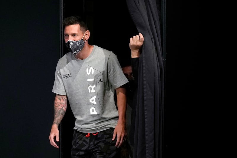 Paris Saint-Germain's Lionel Messi and other team members enter the stage. AP Photo 