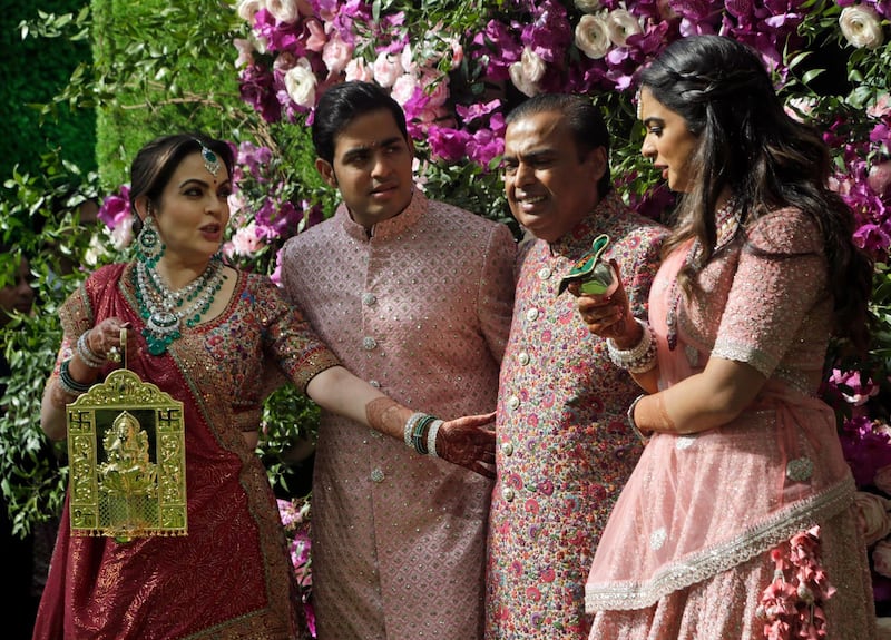 Reliance Industries Chairman Mukesh Ambani, second right, his wife Nita Ambani, left, son Akash Ambani and daughter Isha arrive for Akash's wedding in Mumbai, India, Saturday, March 9, 2019. Photo: AP
