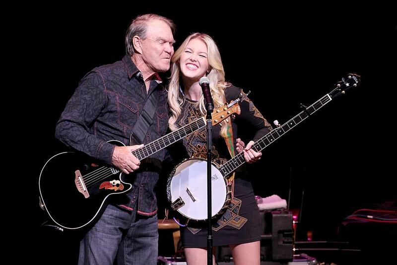Musician Glen Campbell and his daughter Ashley Campbell perform in Austin, Texas, in 2012. Gary Miller/FilmMagic/Getty Images