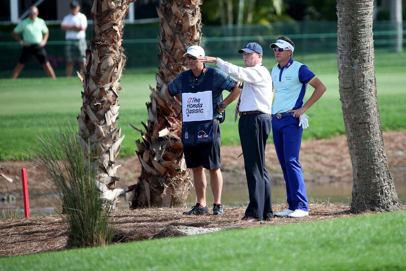 Ian Poulter, right, gets a ruling from Steve Rintoul of the PGA Tour on the 14th hole during the fourth round of the Honda Classic at PGA National Resort & Spa - Champion Course on March 2, 2015 in Palm Beach Gardens, Florida. Sam Greenwood / Getty Images