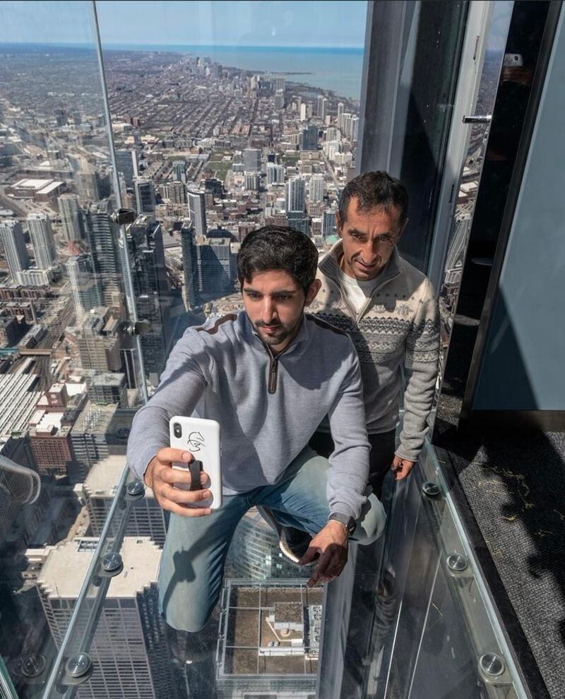 Sheikh Hamdan captures the view from the Willis Tower, once the tallest building in the world, with his uncle Saeed.
