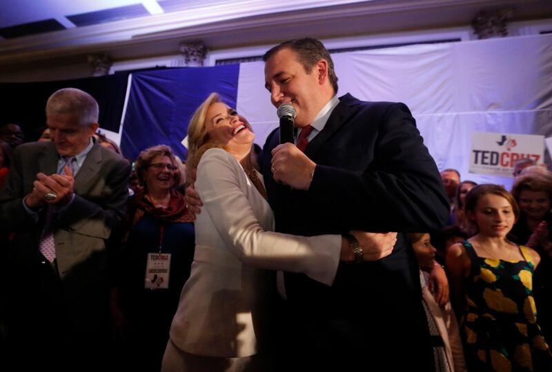 Republican US Senator Ted Cruz is embraced by his wife Heidi at his midterm election night party in Houston, Texas. Reuters