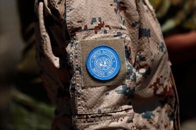 epa08675003 A United Nations patch on an UNDOF (United Nations Disengagement  Observer force) soldier's uniform at Ben Tal overlooking the Israeli-Syrian border, 17 August 2020 (issued 17 September 2020). The United Nations in the year 2020 mark the 75th anniversary, and some peacekeeping missions remain in the region as a reflection of the presence of UN in the Middle East, according to the UN. The United Nations Disengagement Observer Force (UNDOF) was established by the Security Council on 1974, the mandate is to maintain the ceasefire between the parties and supervise the disengagement of Israeli and Syrian forces as well as the so-called areas of separation (a demilitarized buffer zone) and limitation (where Israeli and Syrian troops and equipment are restricted) in the Golan Heights.  EPA/ATEF SAFADI
