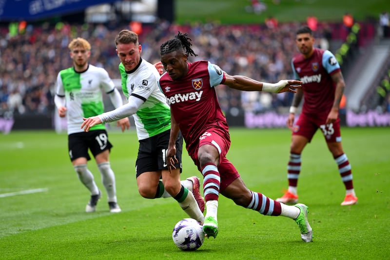 Mohammed Kudus of West Ham United is challenged by Alexis Mac Allister. Getty Images