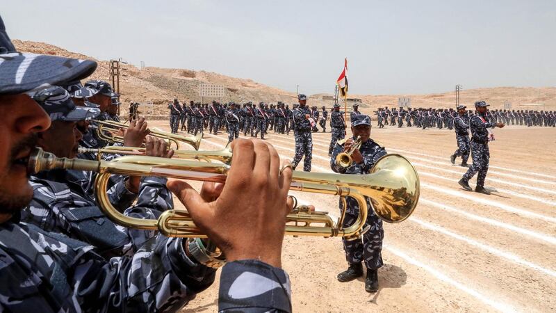 UAE-trained cadets of the Yemeni police, supporting forces loyal to the Saudi and UAE-backed government, playing bugles as comrades march during their graduation in Mukalla. AFP