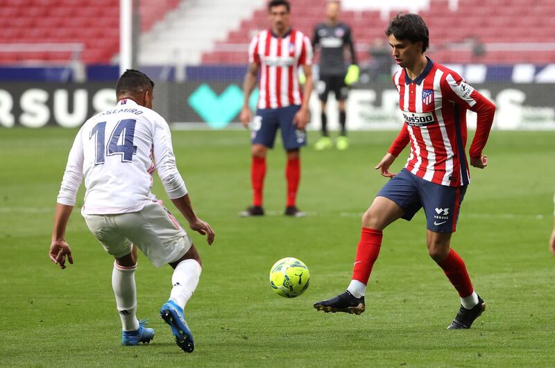 Second-half substitute Joao Felix up against  Real Madrid's Casemiro during the La Liga draw at the Estadio Wanda Metropolitano on March 7.