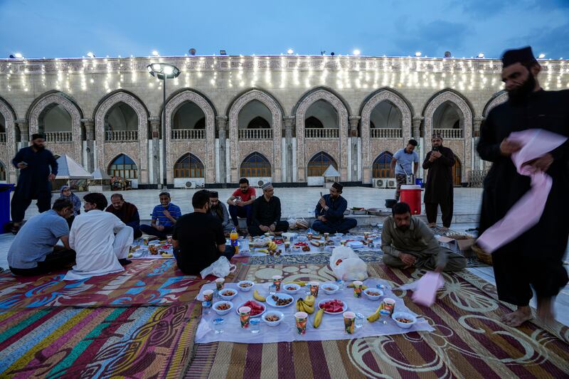 Muslims gather for free Iftar meals at Sheikh Abdul Qader Gilani mosque in Baghdad. AP